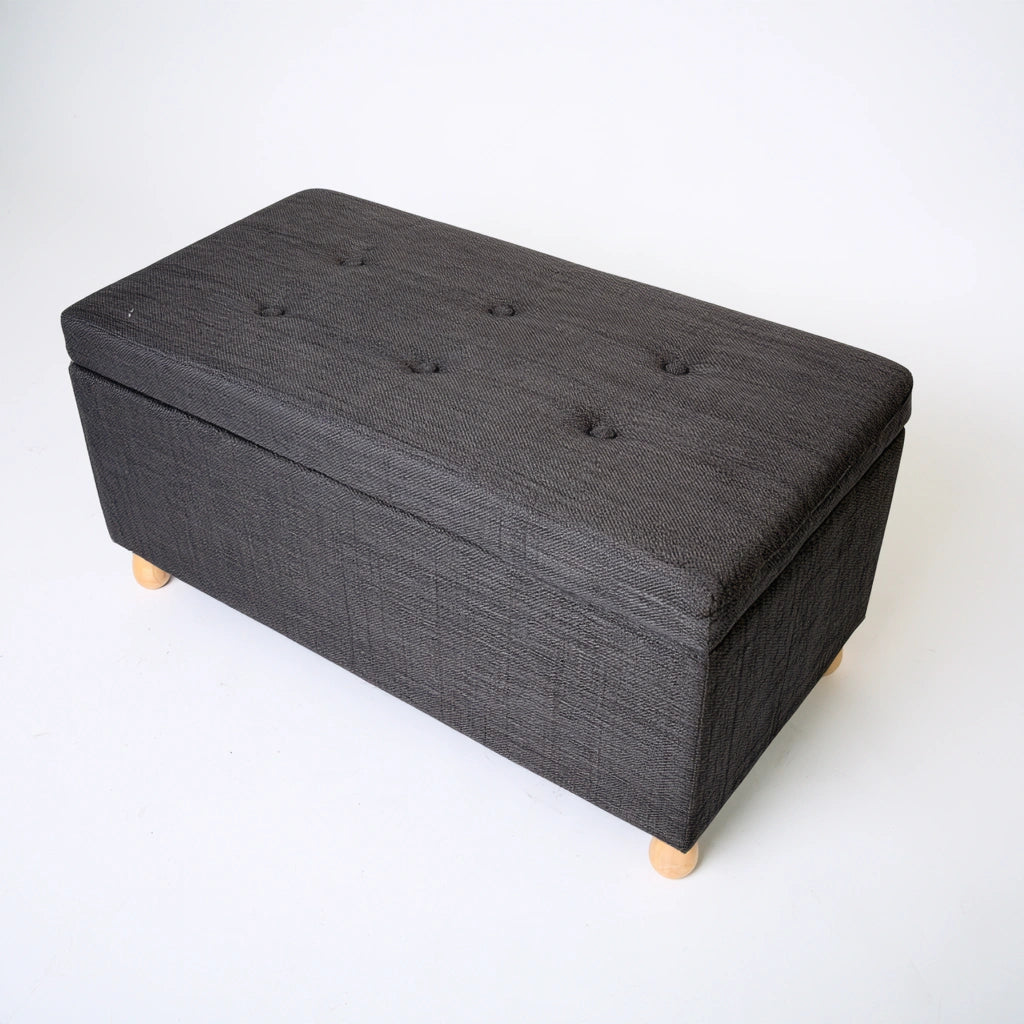 Gray storage bench from Zenoakstudio, modern cuboid design, high-angle view, ideal for living room and home organization.