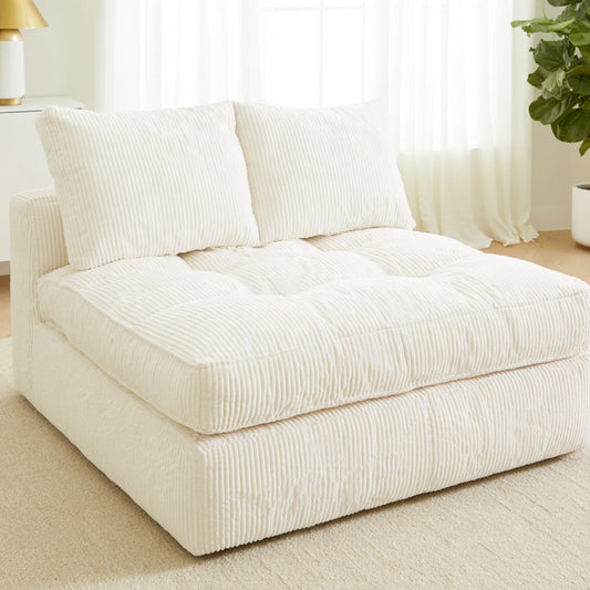 Cream velvet two-seater sofa in cozy living room scene, showcasing Zenoakstudio's stylish and comfortable lounge furniture.
