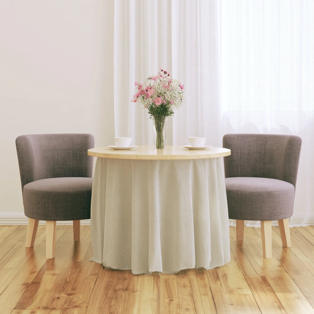 Light brown round wooden side table from Zenoakstudio, ideal for living room or cozy seating areas.