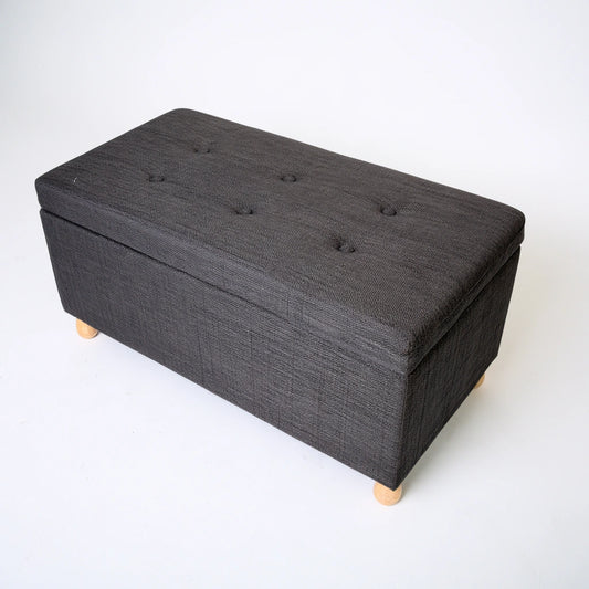 Gray storage bench from Zenoakstudio, modern cuboid design, high-angle view, ideal for living room and home organization.