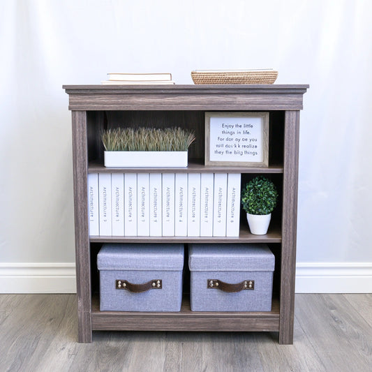 Dark brown wooden bookshelf with three open compartments, part of Zenoakstudio's home and garden library collection.